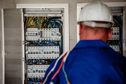 electrician-burbank, electrician in burbank, Electrician repairing a circuit breaker in Burbank, CA
